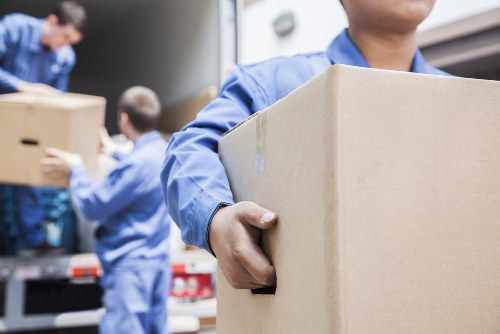 Mover handling boxes safely during a man and van service
