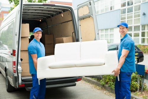Same day removals van loading boxes and furniture in Plumstead