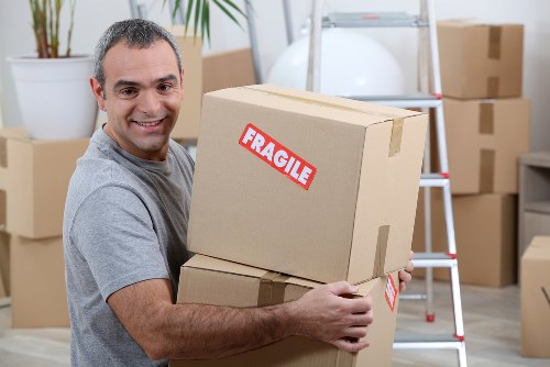 Furniture pick-up service removing a sofa in Plumstead