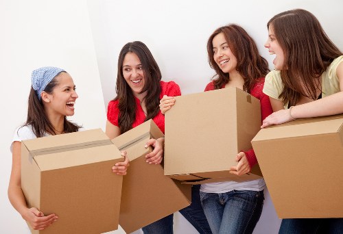 Careful wrapping and labeling of household items during a Plumstead move