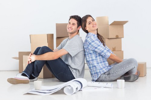 Professional movers loading boxes into a removal van