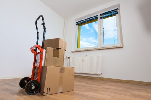 Local Plumstead movers handling furniture and belongings carefully