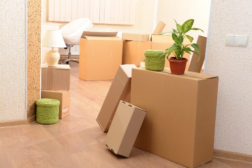 Furniture removal team collecting a sofa and table from a Plumstead property